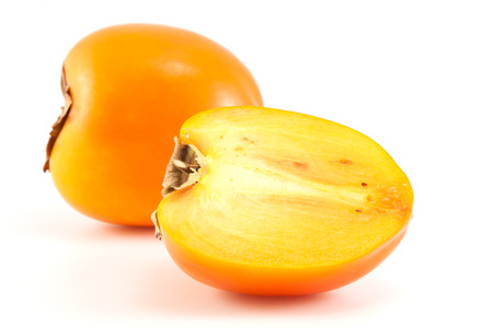 Orange fresh organic persimmon on white backgroundの写真素材