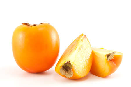 Orange fresh organic persimmon on white backgroundの写真素材