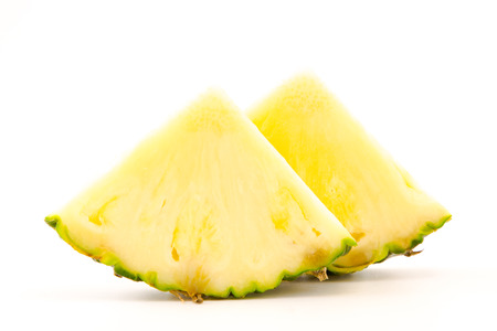 slices of pineapple on white backgroundの写真素材