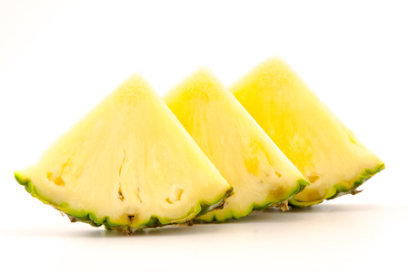 slices of pineapple on white backgroundの写真素材