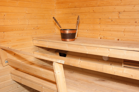 Close-up shot of inside of sauna showing bench, pail.の写真素材