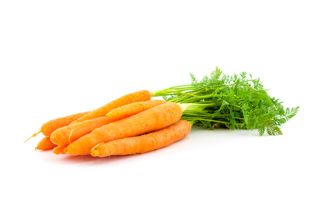 Fresh organic carrots with their tops on white backgroundの写真素材