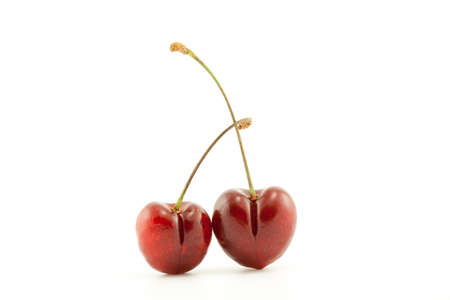 Red cherry berries on a white backgroundの写真素材