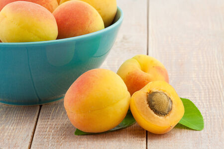 fresh peaches on wooden tableの写真素材