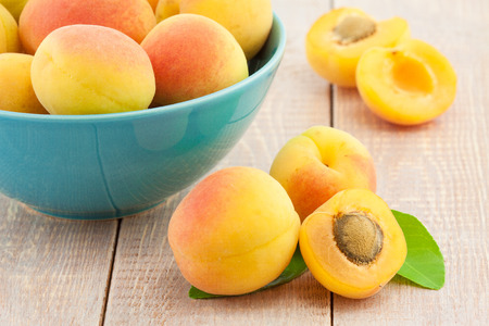 Juicy fresh peaches on wooden tableの写真素材