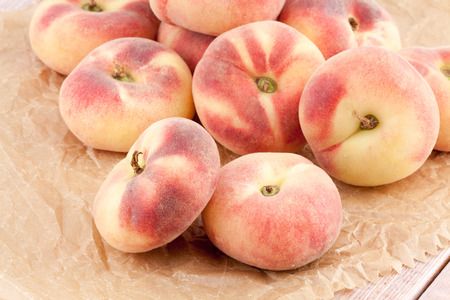 Saturn peaches or chinese flat peachesの写真素材