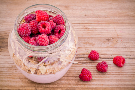 Breakfast mix: cereal with raspberries and yogurtの写真素材