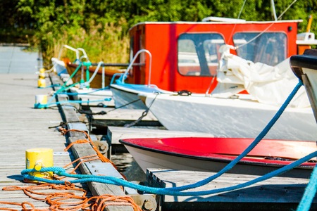 bollard with a rope tied to a pierの写真素材