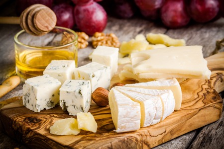 Cheese plate:Emmental, Camembert, Parmesan, blue cheese, bread sticks, walnuts, hazelnuts, honey,...