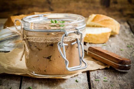 homemade chicken liver pate in the jar on a rustic wooden tableの写真素材