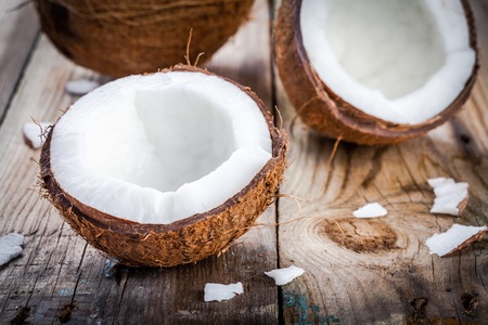 Fresh organic coconut on rustic wooden background