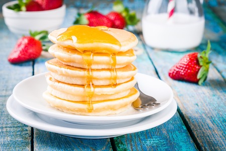 Breakfast: homemade pancakes with honey and strawberries