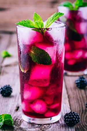 Blackberry smash  cocktail  with lime,  mint and iceの写真素材