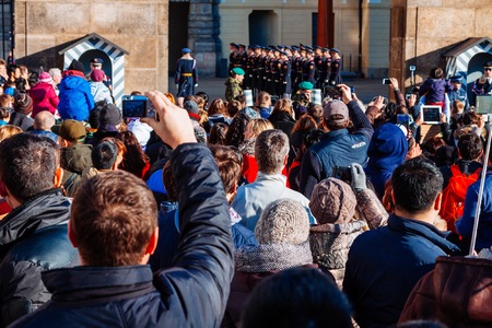 PRAGUE, CZECH REPUBLIC - DECEMBER 23, 2015 : Czechia people and foreigner travelers waiting for the Changing The Guard at gate front of Prague castle in Prague, Czech Republicのeditorial素材