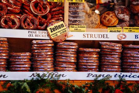 pretzels and other bakery products for sale at Christmas market  Alto Adige, Italy