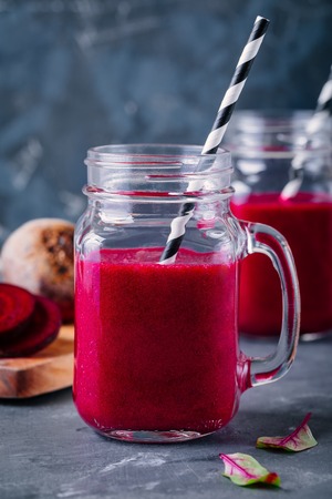 healthy detox beet smoothie with chia seeds in a mason jar on dark backgroundの写真素材