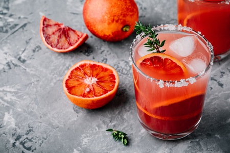 Blood Orange Sangria with ice and thyme on dark backgorundの写真素材