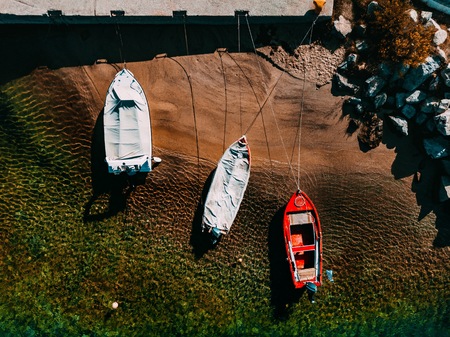 Aerial view of a wooden fishing boats in the sea in Greece.の写真素材