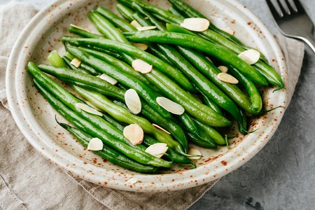 Almondine. Green beans with almonds. Side dish
