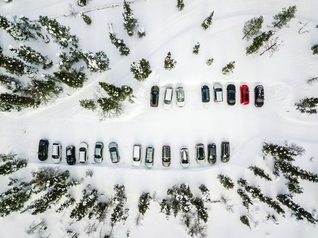 Aerial view of winter parking in the forest in rural Finland, Laplandの写真素材