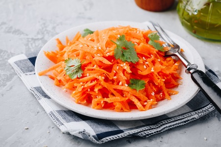 Fresh healthy organic grated carrot salad in bowlの写真素材