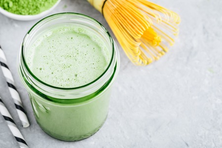 Coconut Vanilla Matcha Smoothie in glass jarの写真素材