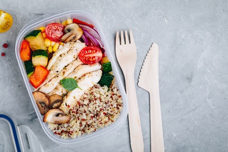 Meal prep lunch box containers with quinoa, grilled vegetables and chickenの写真素材