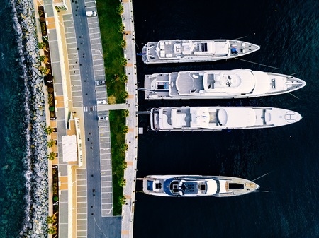 Aerial view from above at the luxury yachts in the marina in Italyの写真素材