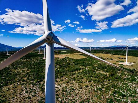 Aerial view of windmills in summer landscape in Croatia. Wind turbines for electric power with clean and Renewable Energyの写真素材