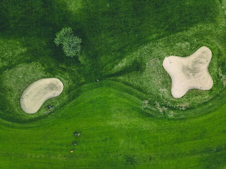 Aerial view of green grass at golf course with ponds in Finlandの写真素材