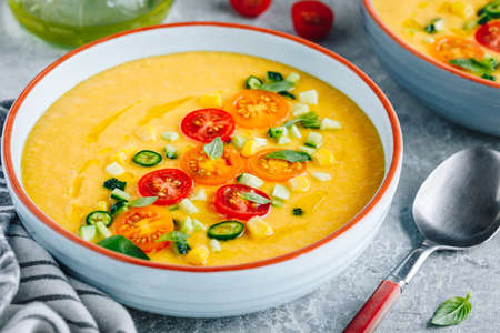 Yellow Tomato Gazpacho. Spanish summer cold soup with fresh vegetables.の写真素材