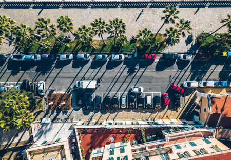 Aerial top view of Italian town by the sea with road, houses, buildings, parks and parking lots.の写真素材