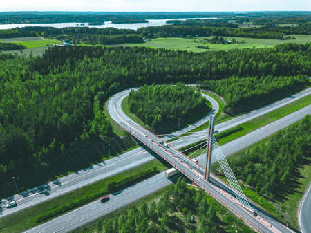 Aerial view of bridge over highway road in Finland. Beautiful summer landscape.の写真素材