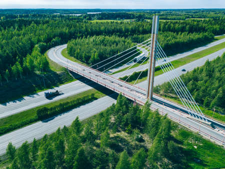 Aerial view of bridge over highway road in Finland. Beautiful summer landscape.の写真素材