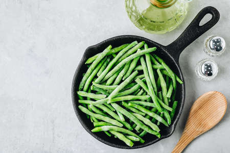 Frozen green beans in a pan ready for cooking. top view with copyspace.の写真素材
