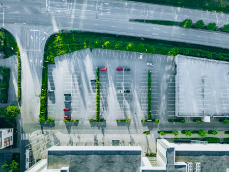 Aerial view of cars in a parking lot, almost empty parking lots near a residential building or...