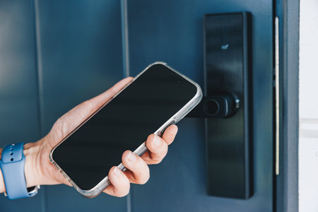 Woman's hand opening and closing the house with the smart home system. NFC Technology, keycard, PIN...