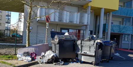 Pile of waste overflowing from public bins during garbage collectors strikeの写真素材