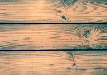 Closeup of old panels or planks, vintage wood texture with knots. Background concept.