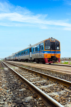 Thai train on rock railway with blue sky