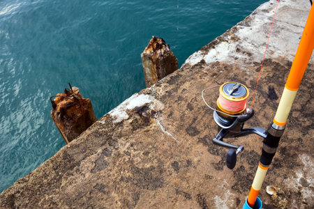 fishing rod at pier bridge sea prepare for livingの写真素材