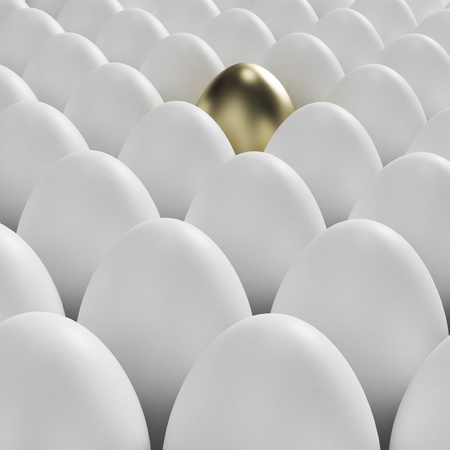 Individuality: golden egg among usual white eggsの写真素材