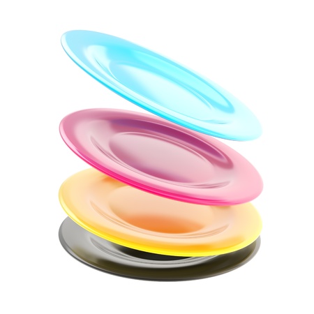 Stack of cmyk colored ceramic plate dishes in a motion isolated on white backgroundの写真素材