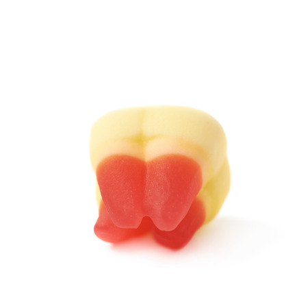 Tooth shaped chewing candy isolated over the white backgroundの写真素材