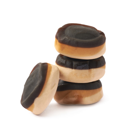 Pile of chocolate coated chewing candy isolated over the white backgroundの写真素材