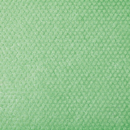 Green kitchen wipe cloth close-up fragment as a background textureの写真素材