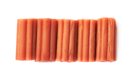 Red licorice stick chewing candy isolated over the white backgroundの写真素材
