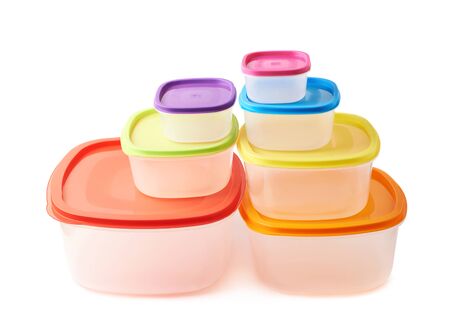 Pyramid pile of colorful plastic food containers, composition isolated over the white backgroundの写真素材