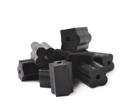 Pile of black licorice candy isolated over the white backgroundの写真素材