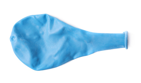 Deflated rubber blue air balloon isolated over the white backgroundの写真素材